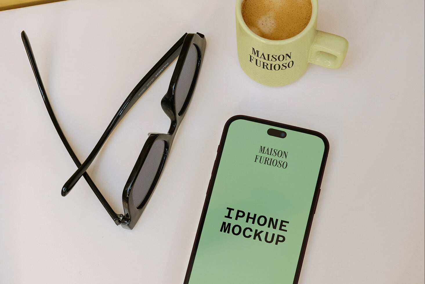 iPhone mockup with sunglasses, coffee mug, pens on white desk flat lay