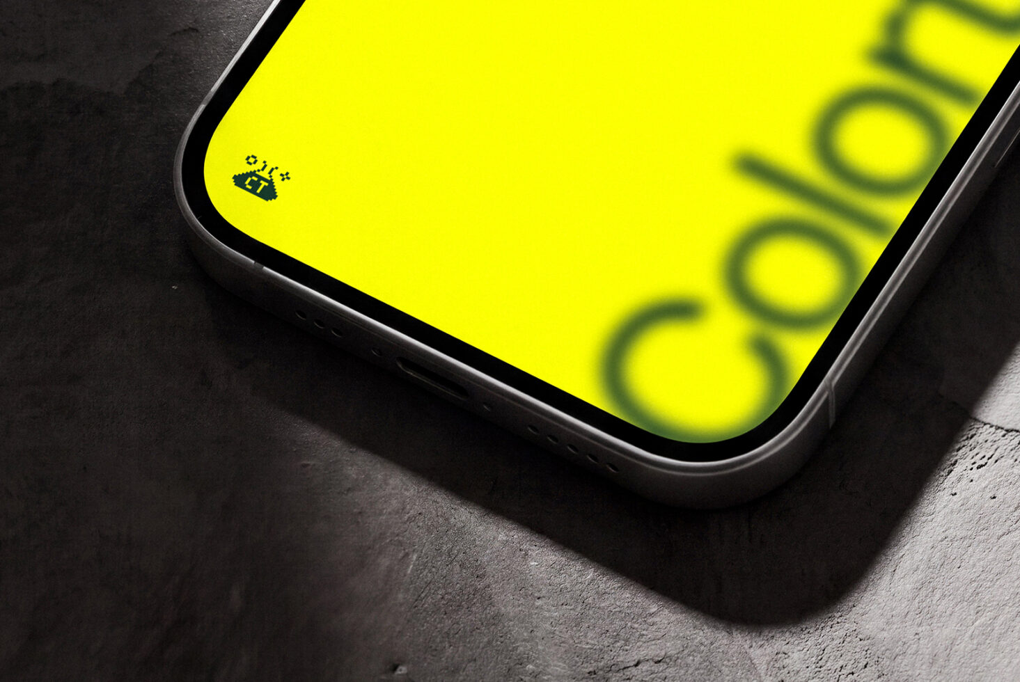 Smartphone mockup with neon yellow screen on concrete background
