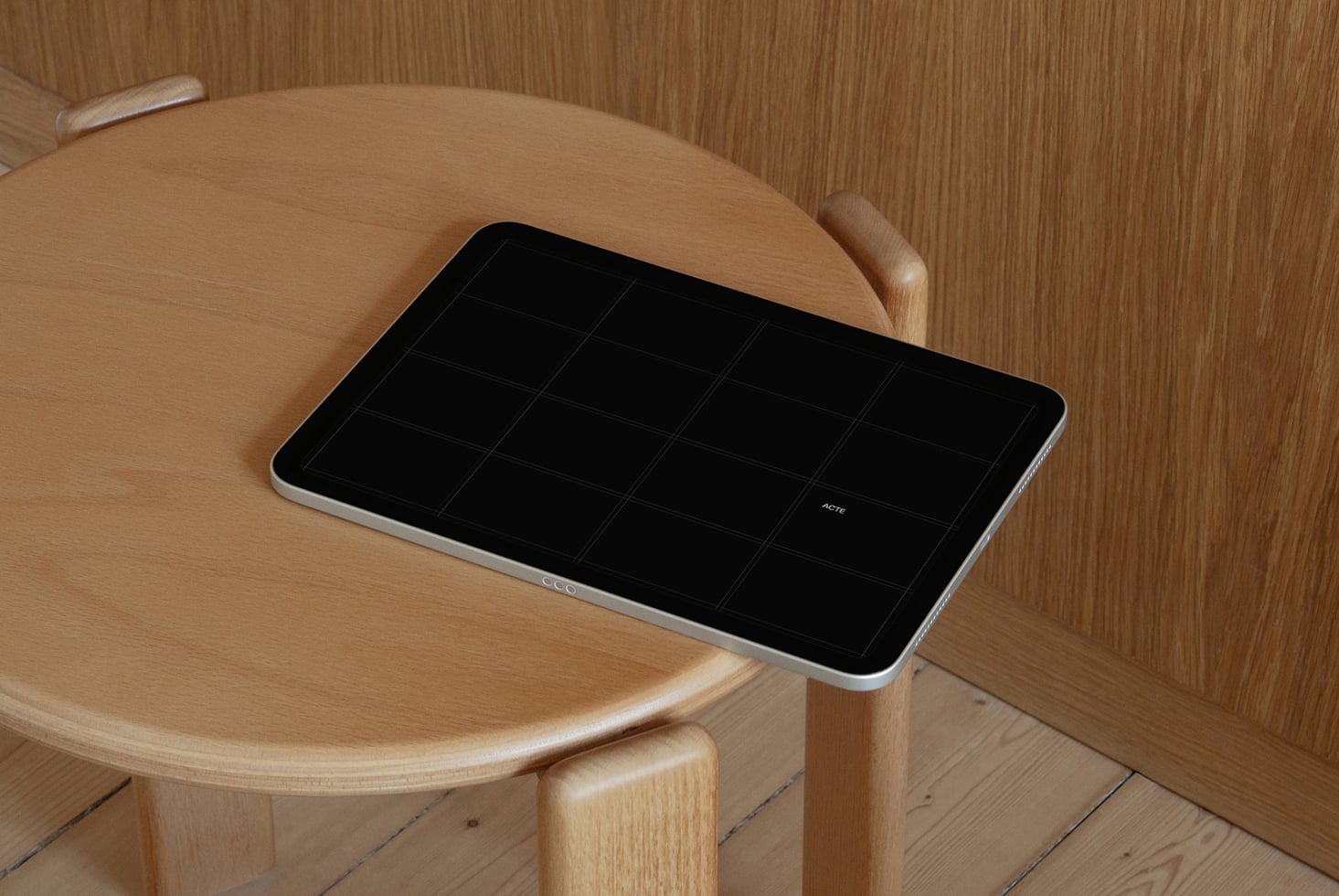 Tablet on wooden round table with grid layout mockup ready to customize