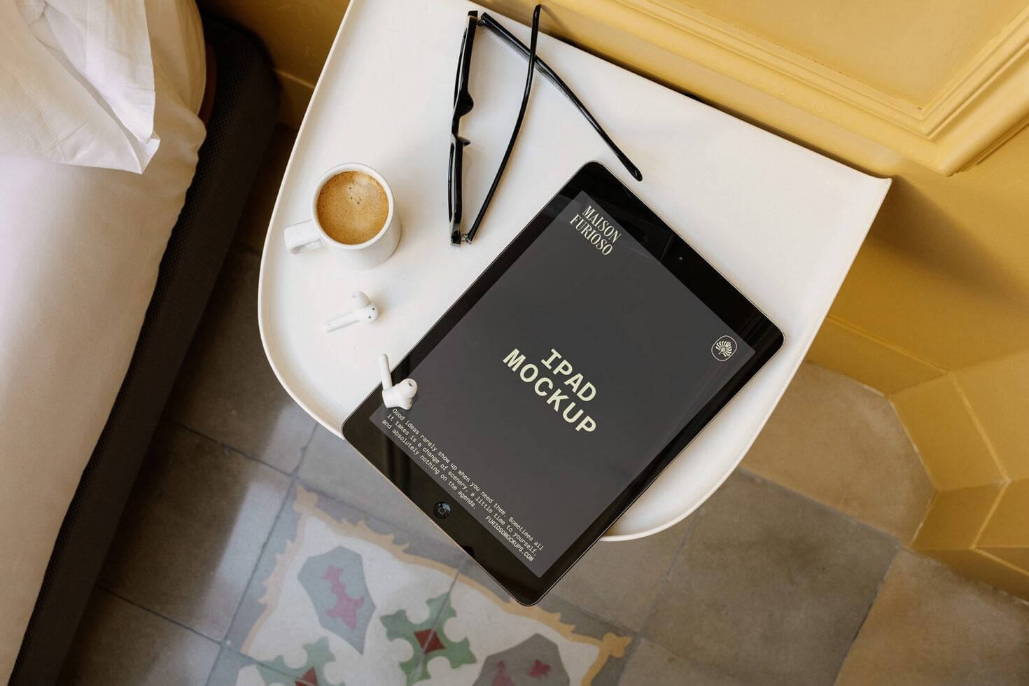 Tablet mockup on minimal desk setup with coffee, glasses, earbuds, notebook overhead view