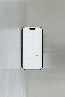 iPhone 14 Pro mockup with grid overlay on minimal neutral background