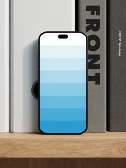 iPhone 14 Pro mockup with blue gradient screen leaning on books