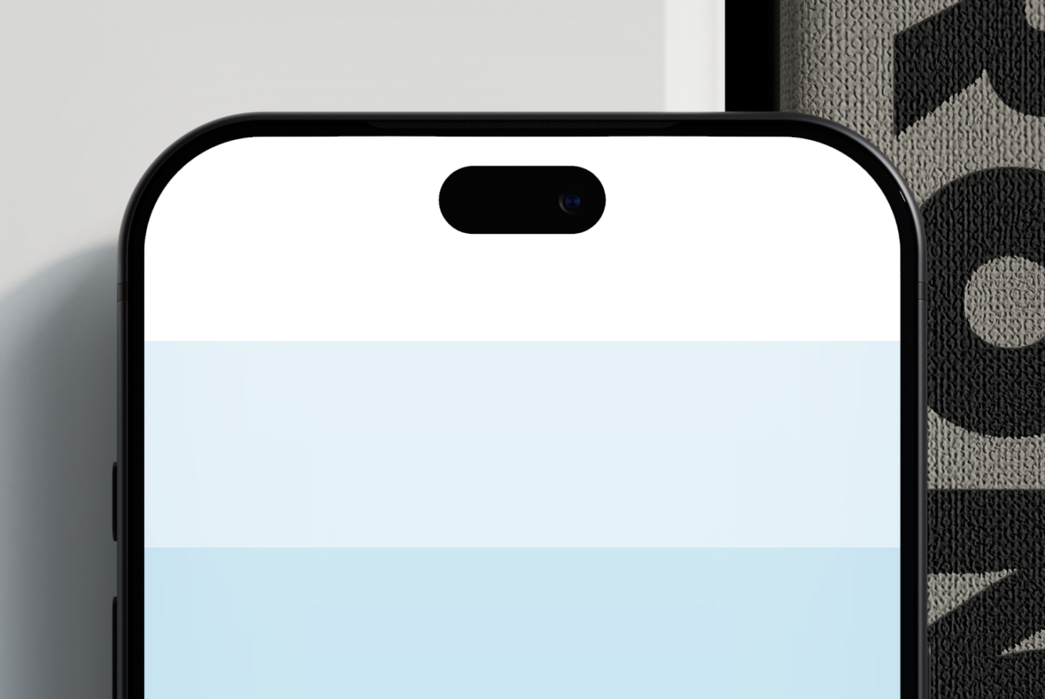 iPhone 14 Pro mockup with notch, blank screen, positioned on textured fabric background