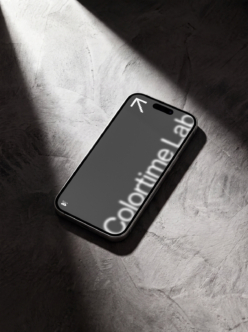 Black phone mockup on concrete with dramatic window light casting shadows