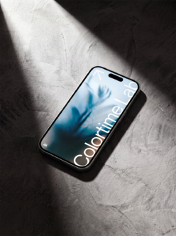 iPhone 14 Pro mockup with blue gradient display on concrete with dramatic sunlight