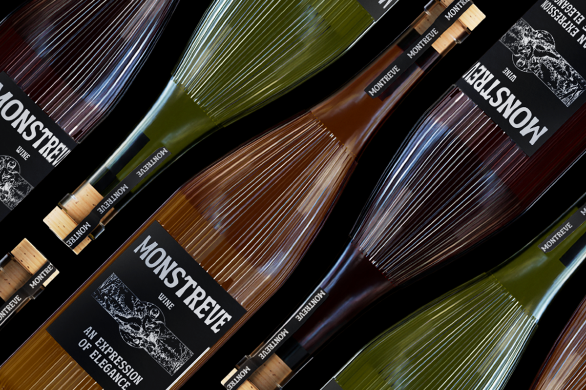 Wine bottles with black labels arranged on dark background showing cork tops