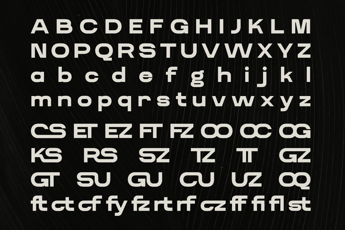 Bold sans serif font with uppercase, lowercase, ligatures on textured black background