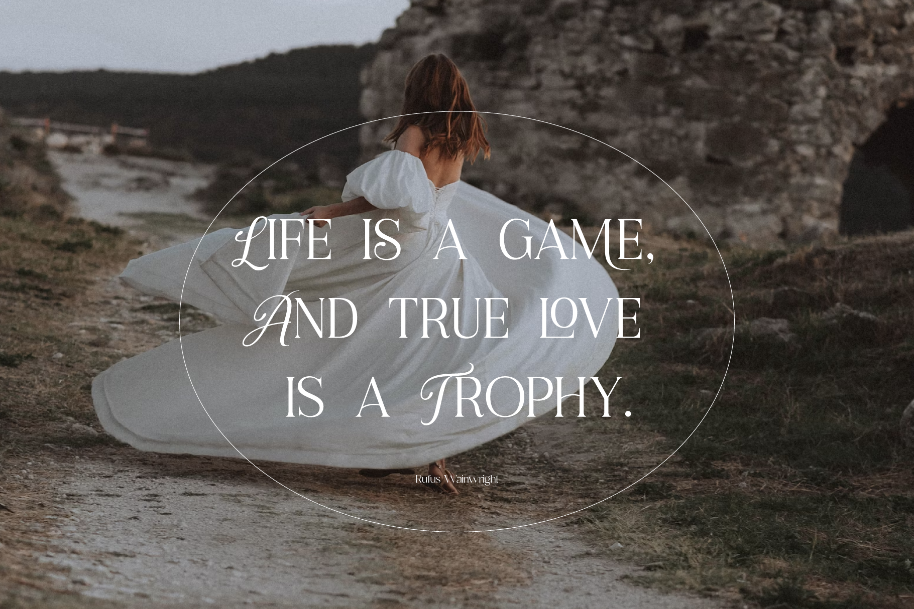 Woman in white dress sitting by rocky cliffs with inspirational quote overlay in elegant script