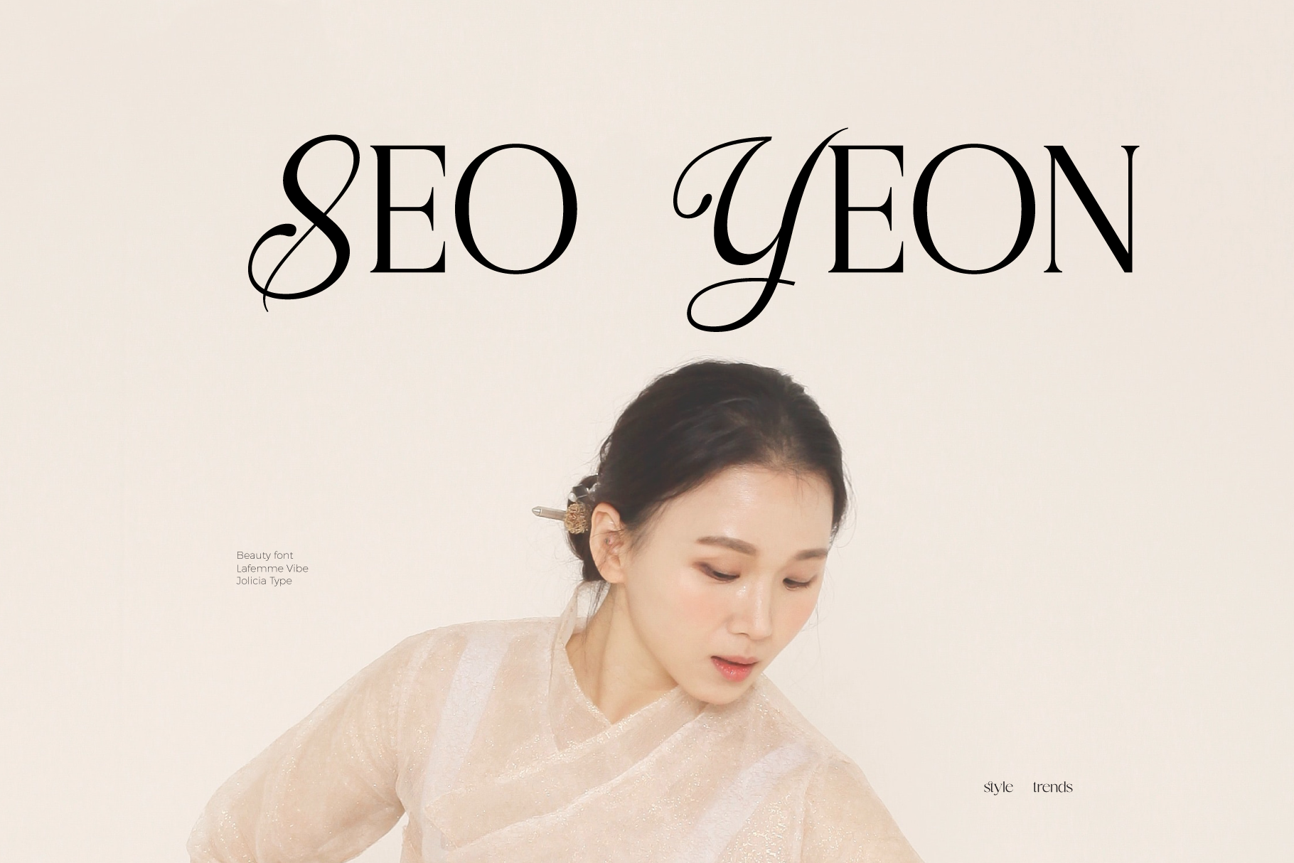 Elegant serif font display with woman in cream colored top against beige background