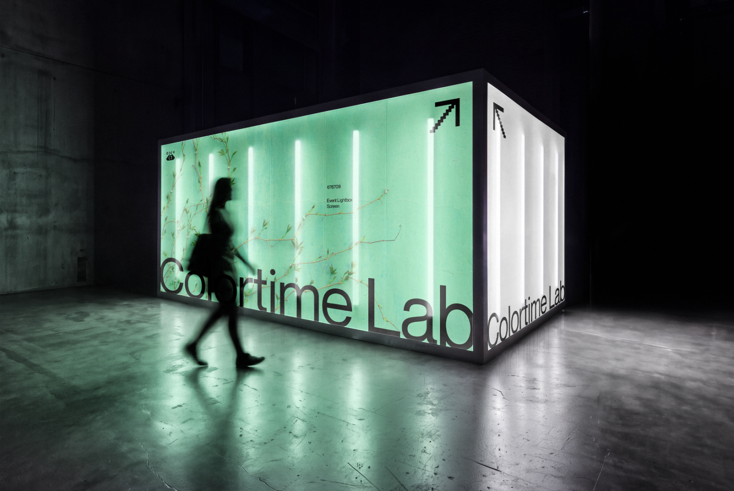Neon-lit kiosk mockup with mint green display, vertical light tubes, botanical graphics, person walking by in dark warehouse space