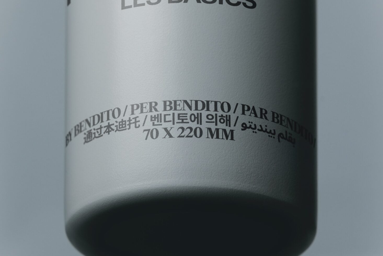 Cylindrical product bottle mockup with multilingual bend label text in various scripts