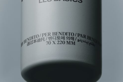 Cylindrical product bottle mockup with multilingual bend label text in various scripts