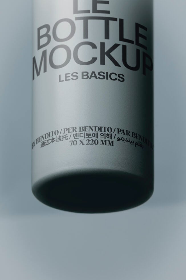 Cylindrical bottle mockup with multilingual label showing Les Basics branding on white background