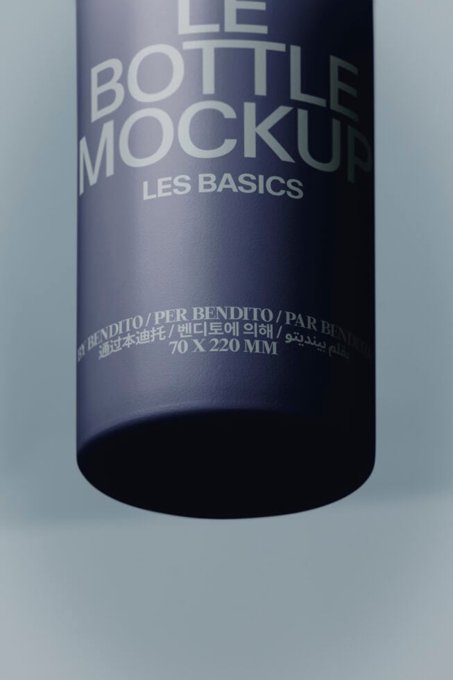 Sleek dark bottle mockup with multilingual label showing Les Basics branding