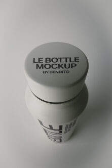 Minimal white bottle mockup with screw cap showing top branding placement on clean gray background