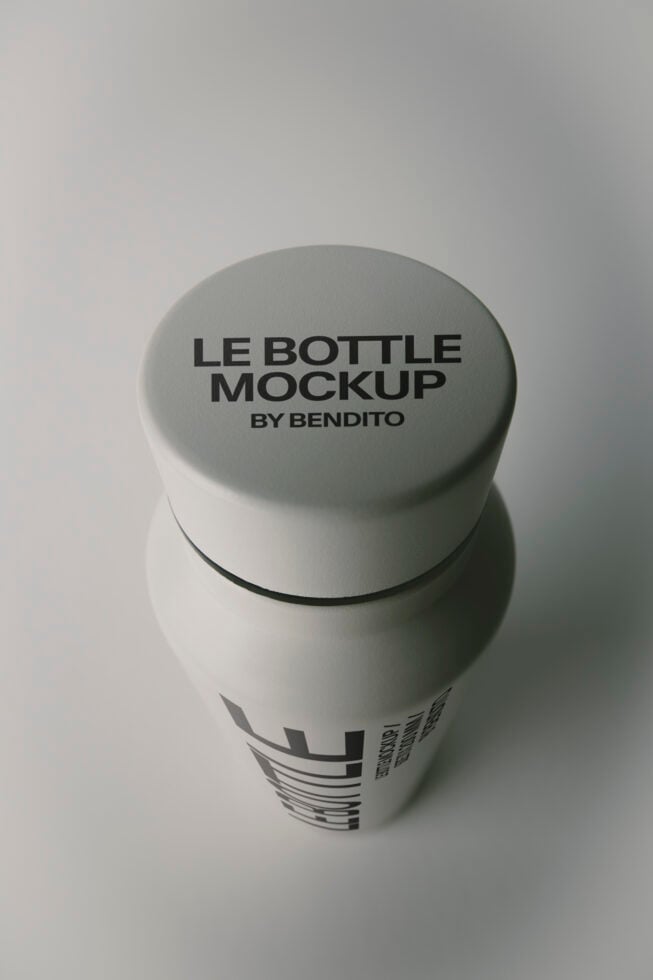 Minimal white bottle mockup with screw cap showing top branding placement on clean gray background