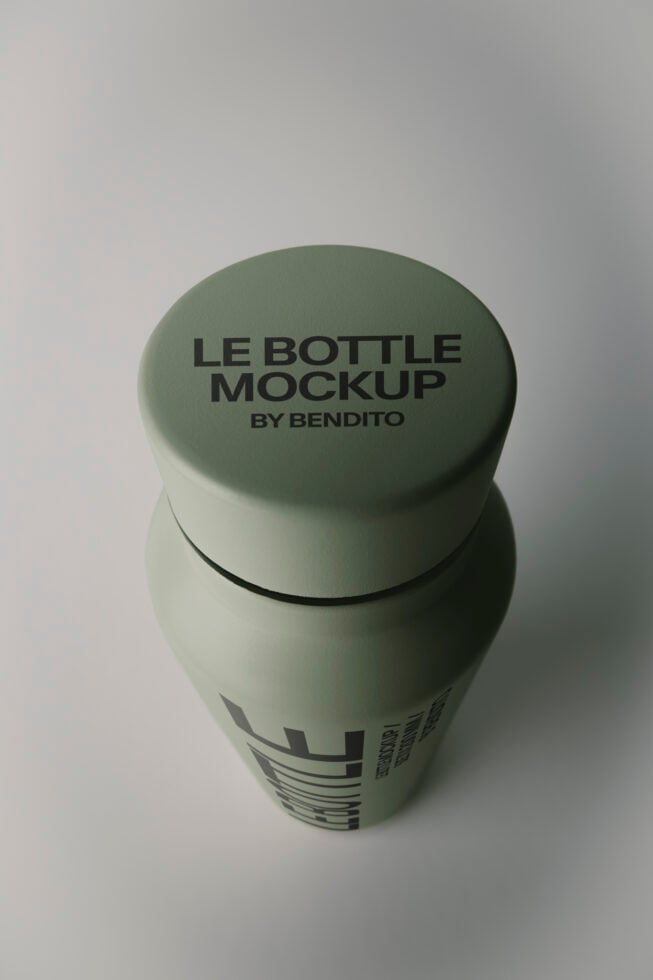 Sage green bottle mockup with screw cap showing label design on clean studio background