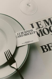 Business card mockup styled with dinnerware, fork, wine glass, napkin