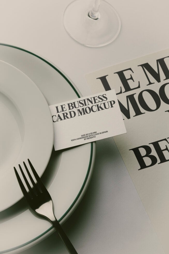 Business card mockup styled with dinnerware, fork, wine glass, napkin