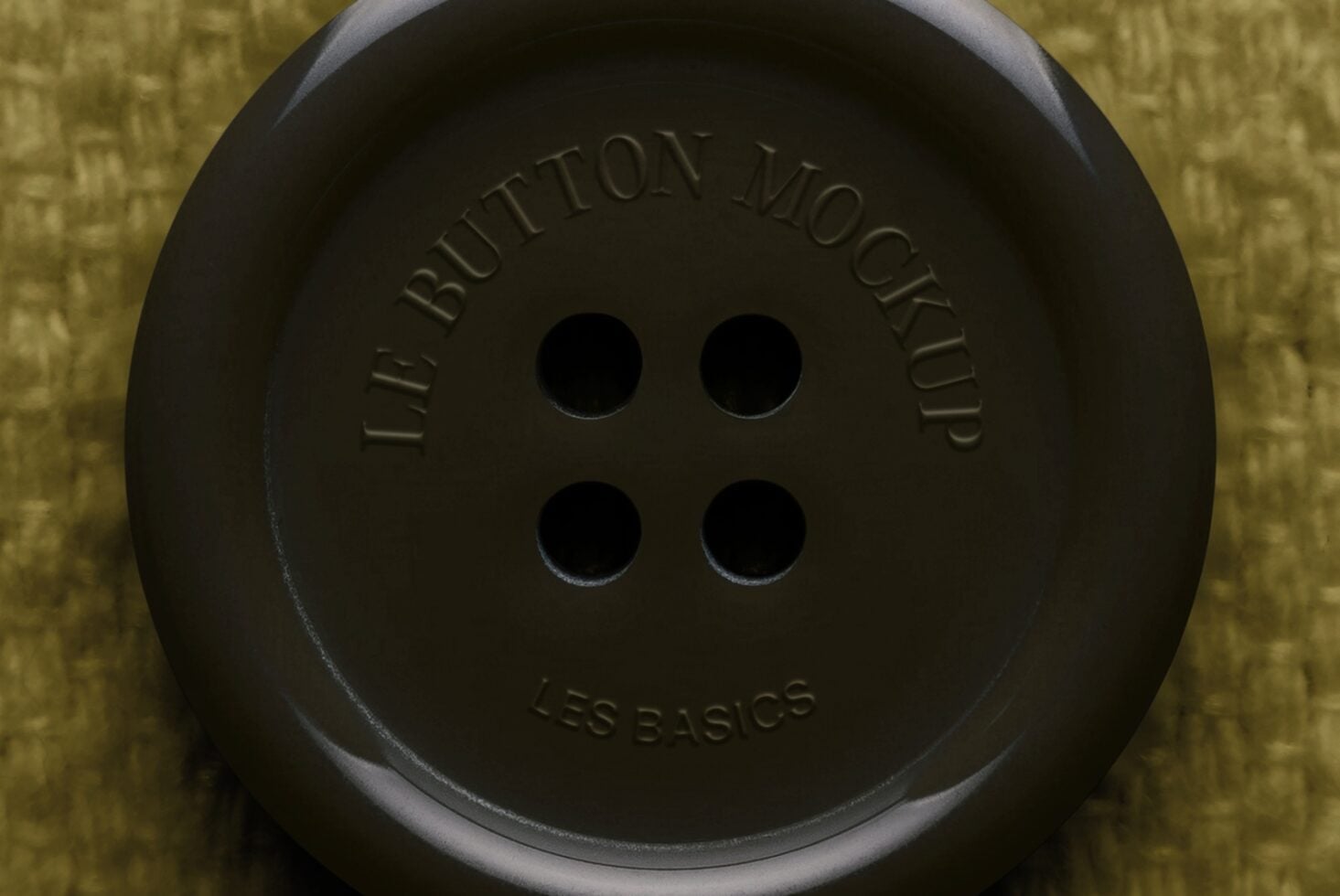 Oversized black button with embossed text on yellow textured background, product mockup