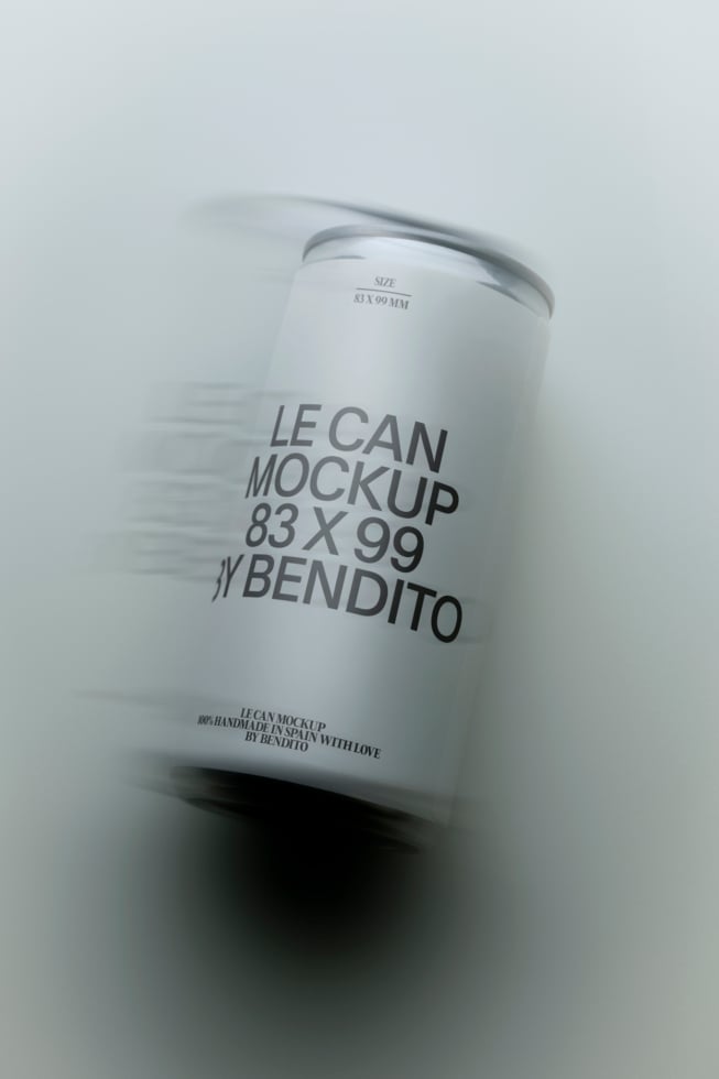 White aluminum can mockup with metallic rim, angled shot showing label wrap on soft gray background