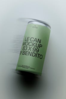 Tall slim can mockup with soft green label, silver rim, angled perspective on light gray background