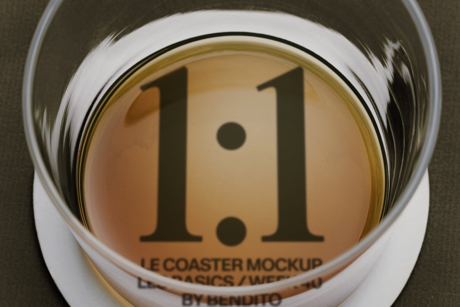 Overhead shot of ceramic coaster mockup with serif numbers 1.1 printed on tan surface inside white rim