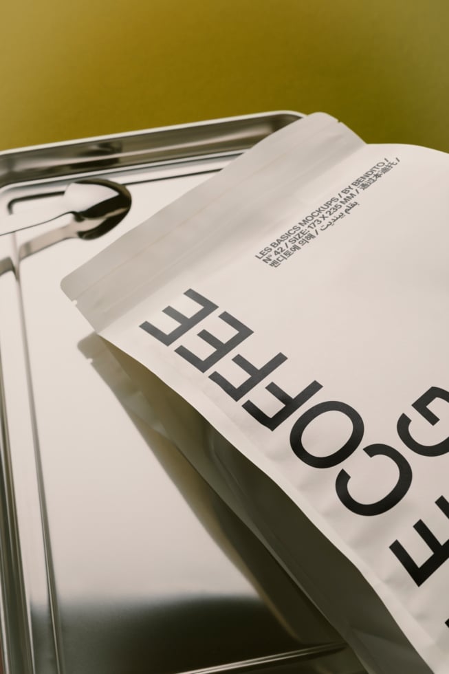 Magazine mockup with bold typography on olive backdrop, metal tray included