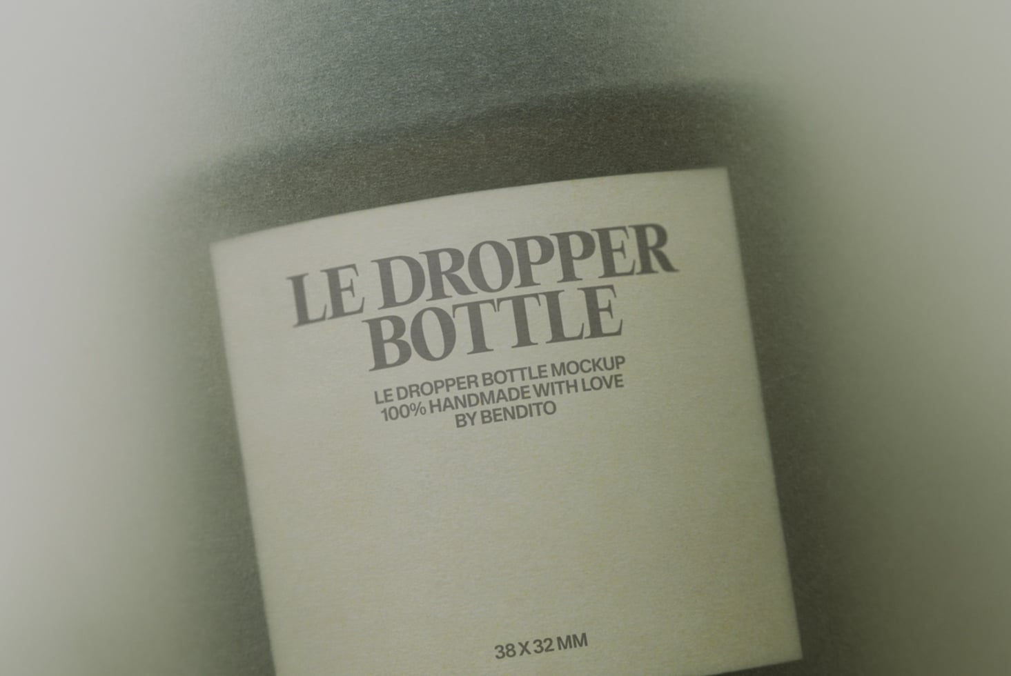 Cream colored dropper bottle box with grey serif typography on neutral linen background