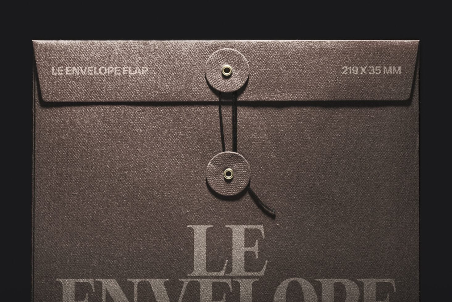 Textured brown envelope mockup with dual string closures, branding embossed on flap