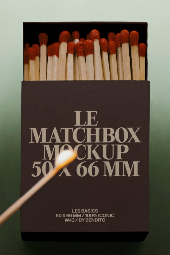 Matchbox mockup with red-tipped wooden matches spilling out, dark brown box labeled Le Matchbox Mockup 50 x 66 MM