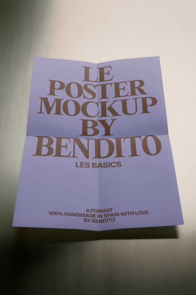Folded lavender poster mockup with serif typography showing Bendito branding in bronze text