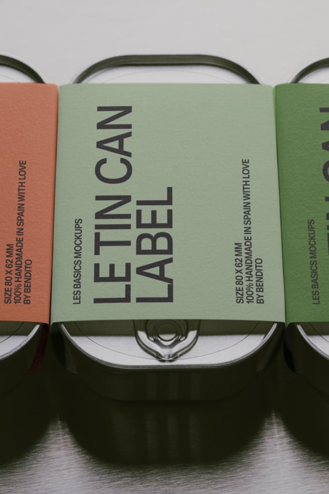 Tin can label mockup showing sage green, terracotta, forest green variants with dark handles