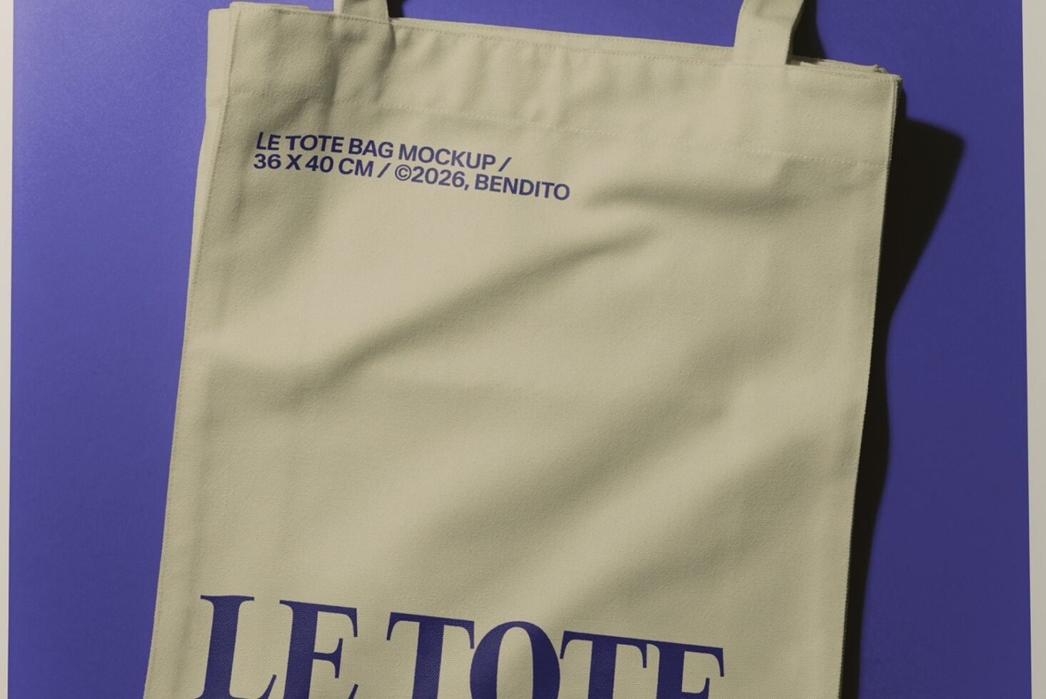 Cream canvas tote bag with navy text on vibrant purple background showing branding mockup