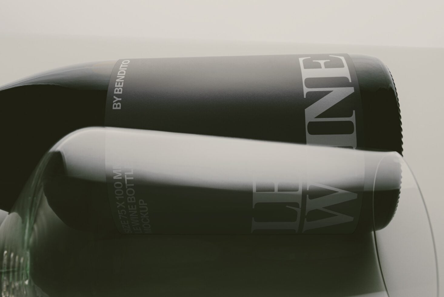 Sleek black cosmetic bottles stacked together with minimalist silver branding labels visible