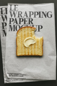 Buttered toast on kraft wrapping paper mockup with bold serif typography overlay