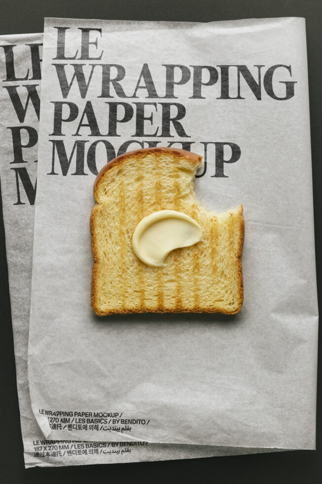 Buttered toast on kraft wrapping paper mockup with bold serif typography overlay