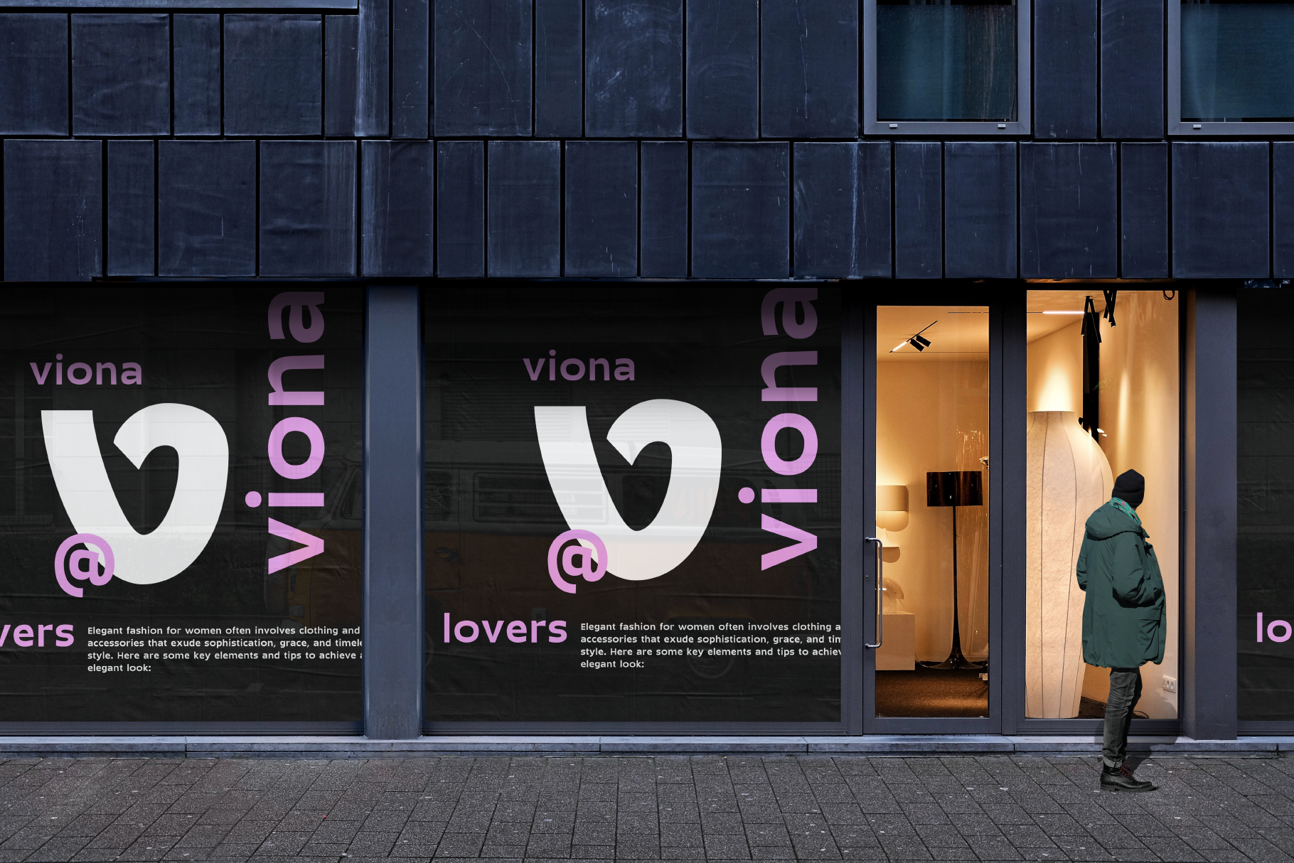 Storefront mockup with black window displays, purple branding for viona lovers fashion brand, warm lit interior visible through glass doors
