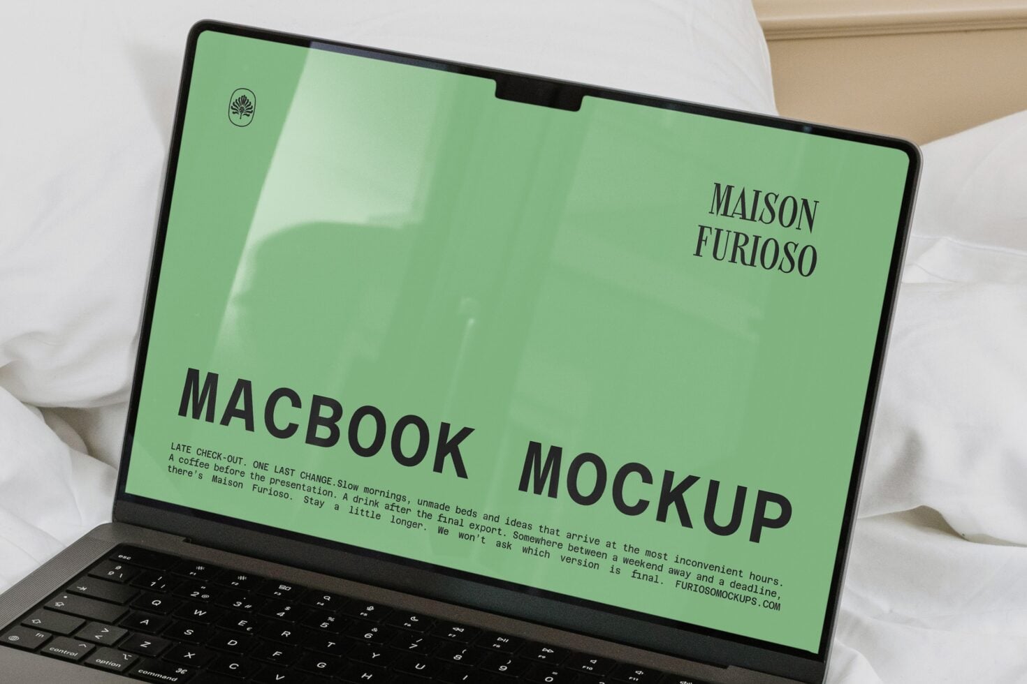 Bright green MacBook screen mockup showing Maison Furioso branding with serif typography on marble desktop