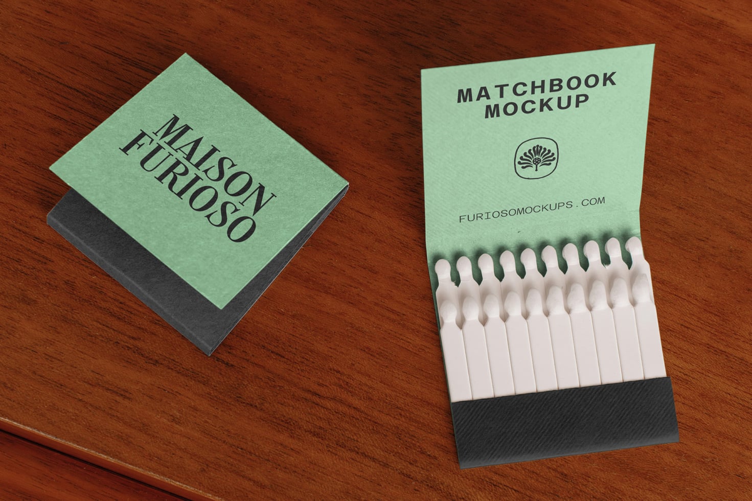 Mint green matchbook with black text sitting next to open matchbook showing white matches on wood surface