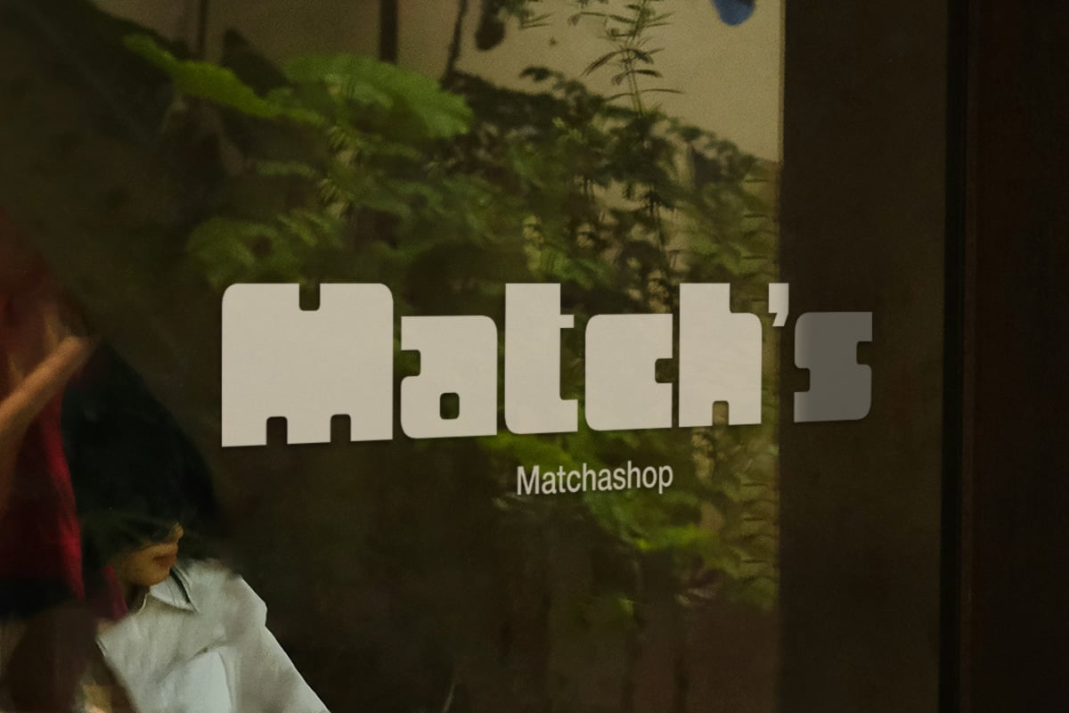 Bold cream letterforms spell out "Matchas" with "Matchashop" subtitle overlaid on moody green foliage background