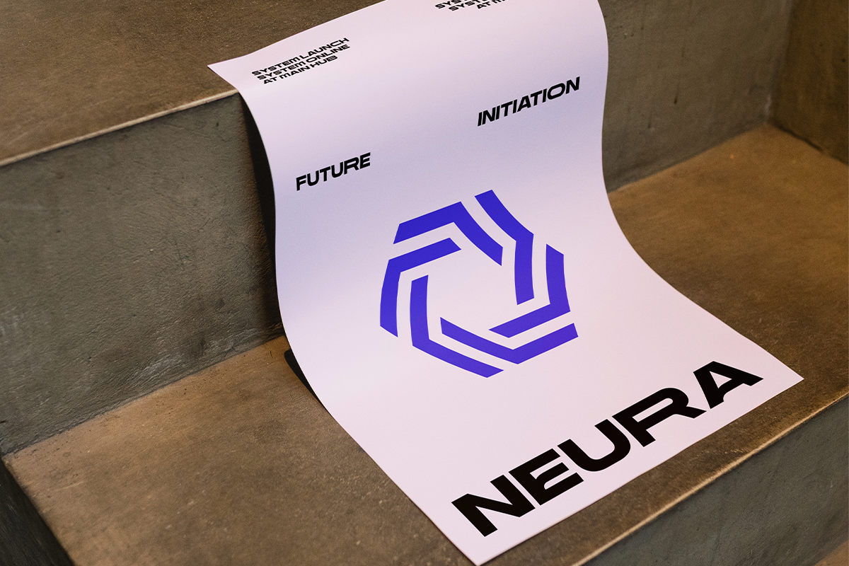 Folded white paper mockup with blue geometric logo, "Future Initiation" text, sits on concrete ledge