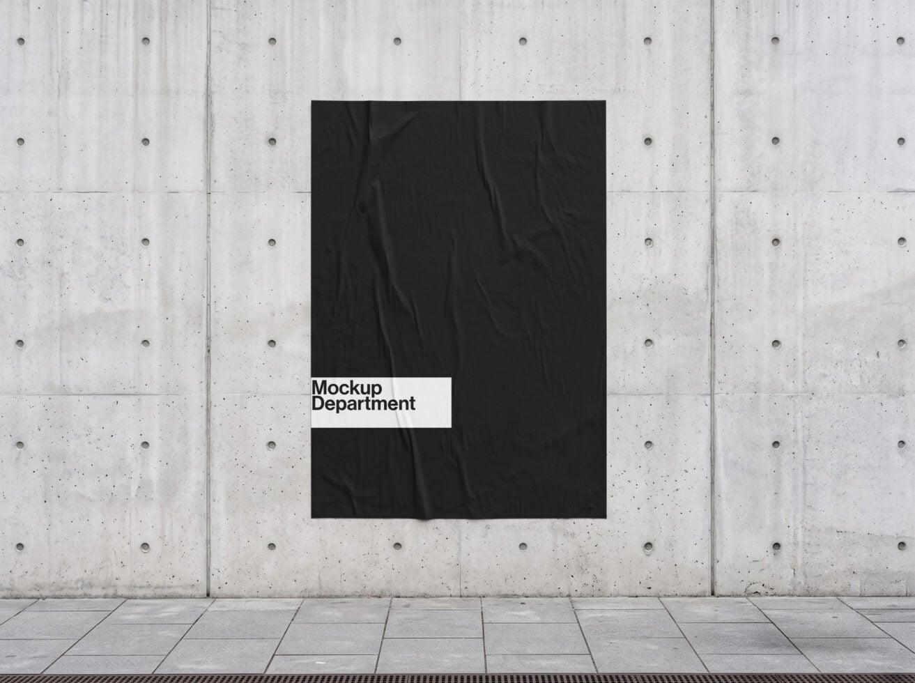 Black poster with white label on concrete wall mockup