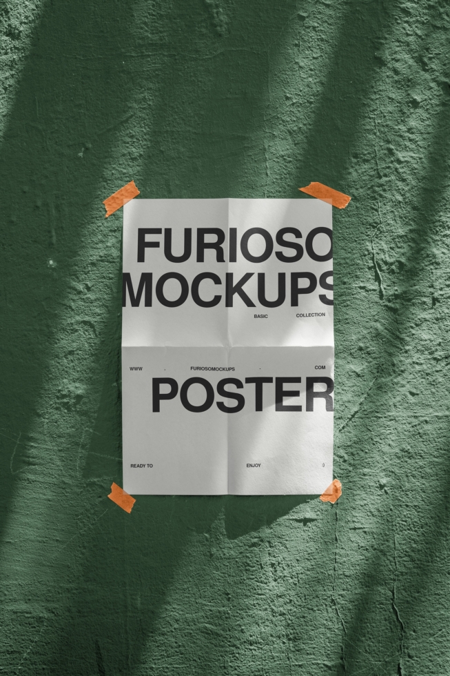 Folded poster mockup taped to textured green wall with orange tape corners