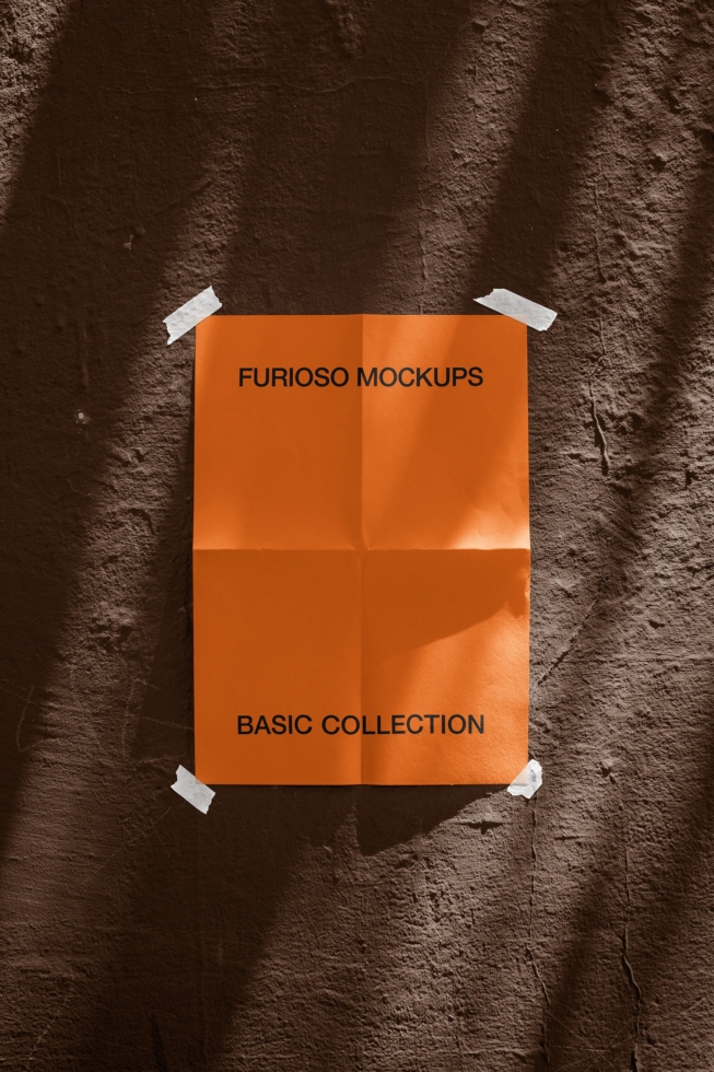 Bright orange poster taped to rough brown wall with harsh shadows, Furioso Mockups Basic Collection branding