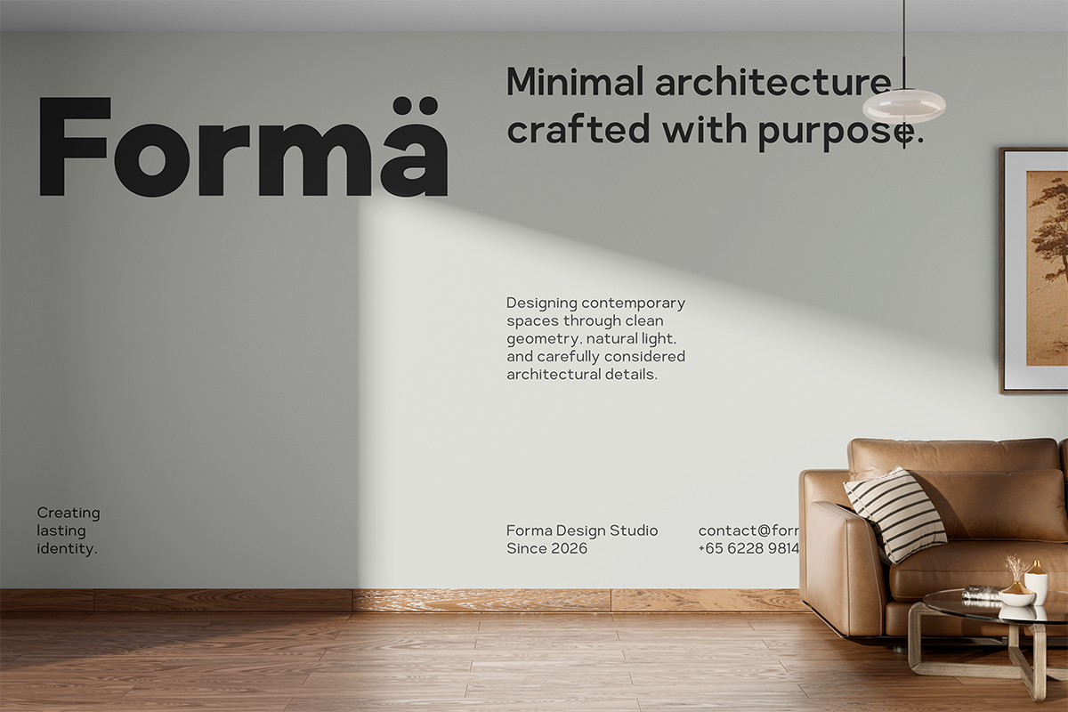Minimal interior with Forma branding on gray wall, leather sofa, wooden floors, natural light streaming in