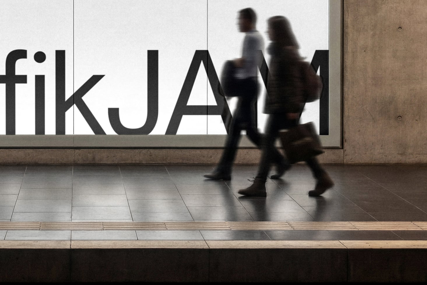 Blurred people walking past storefront window with bold black sans serif lettering on white background