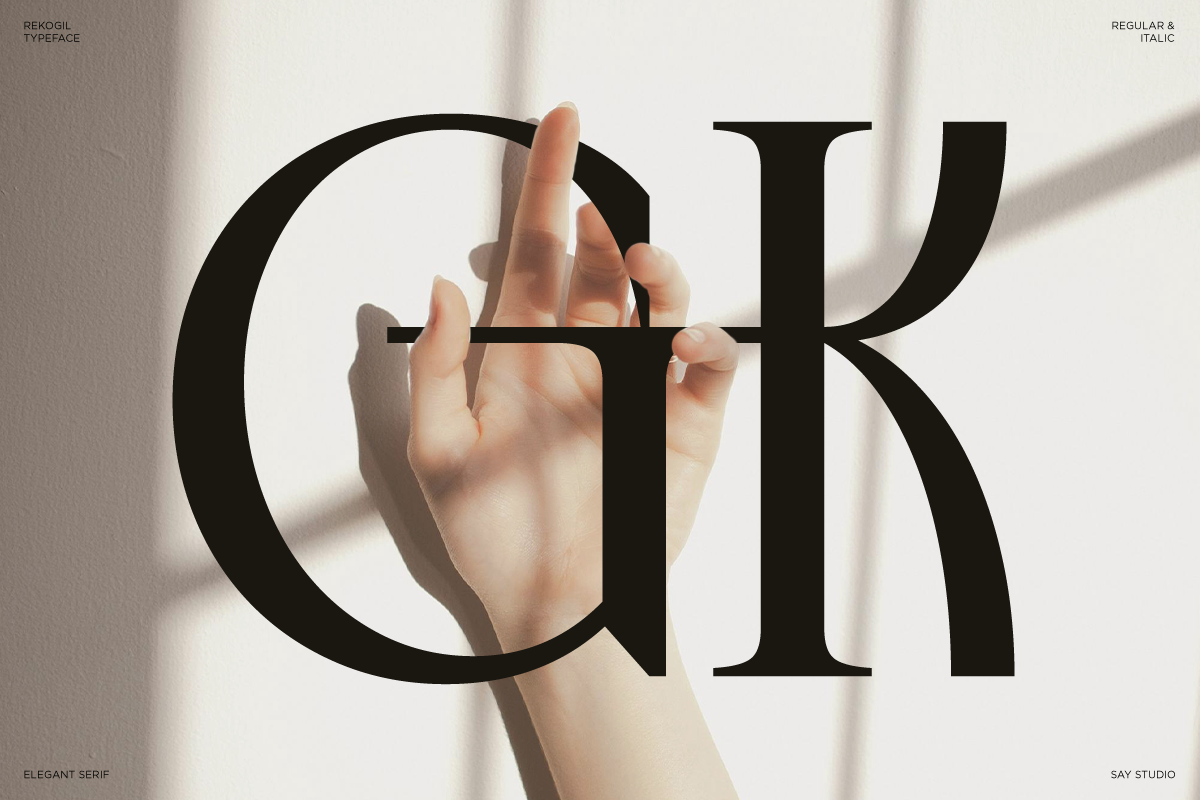Hand holding serif typeface letterforms with soft shadow on white background