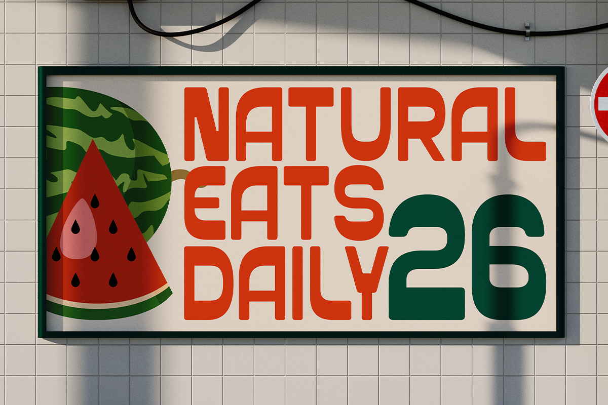 Retro deli sign mockup with watermelon slice graphic, bold red typography, mounted on tile wall