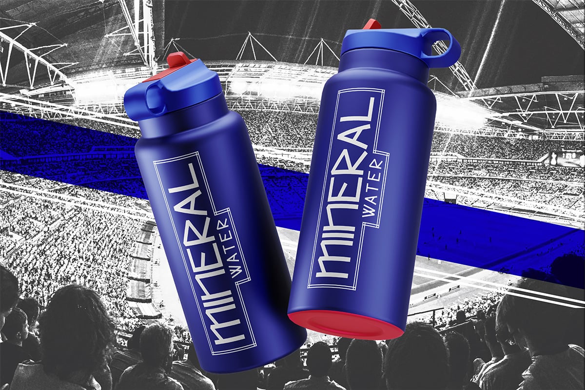 Blue water bottles with red accents displayed against a stadium crowd background in selective color